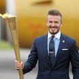 David Beckham with the Olympic Flame