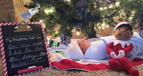 baby under christmas tree facebook